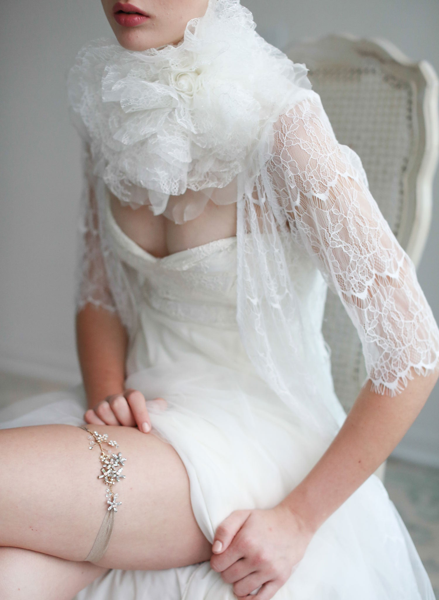 White girdle put on a leg of a bride shortly before the wedding